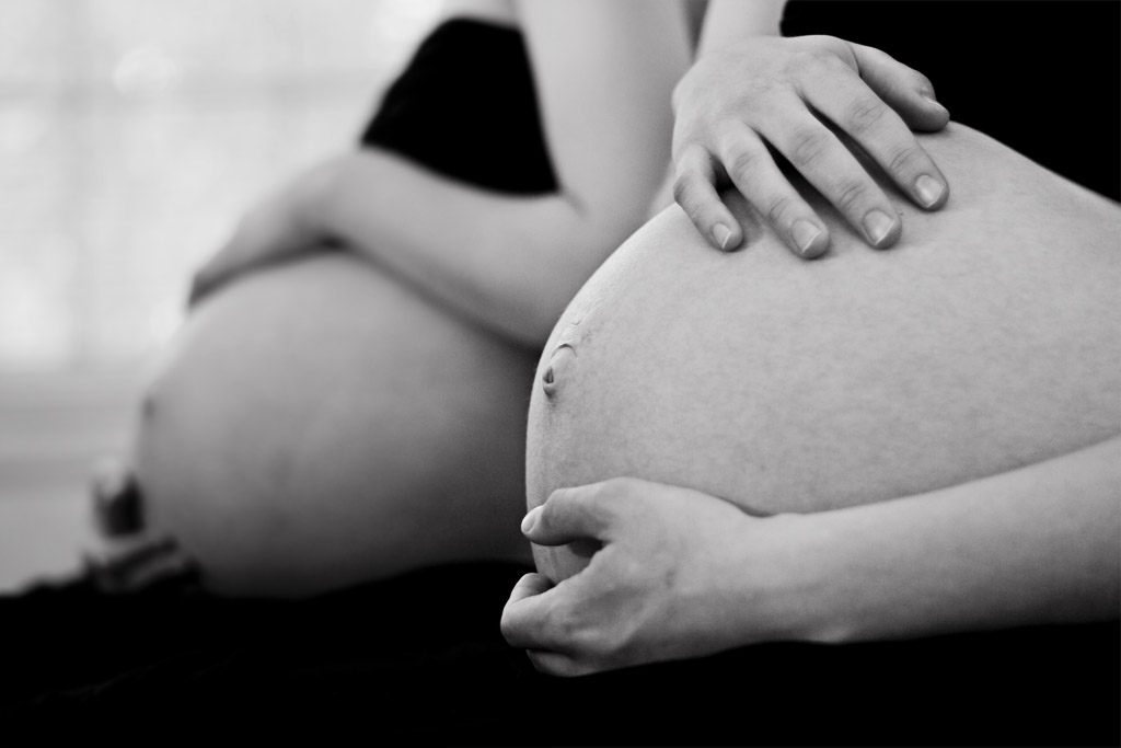 Mirrored pregnant woman